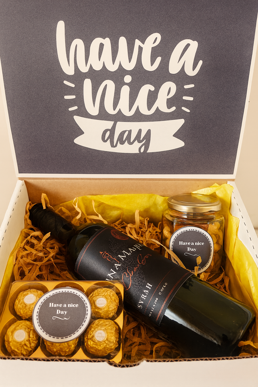 regalo con botella de vino tinto chileno ferrero rocher y botanas