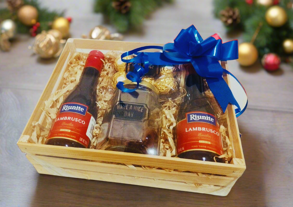 huacal con vino tinto espumoso y pretzel de chocolate navideño