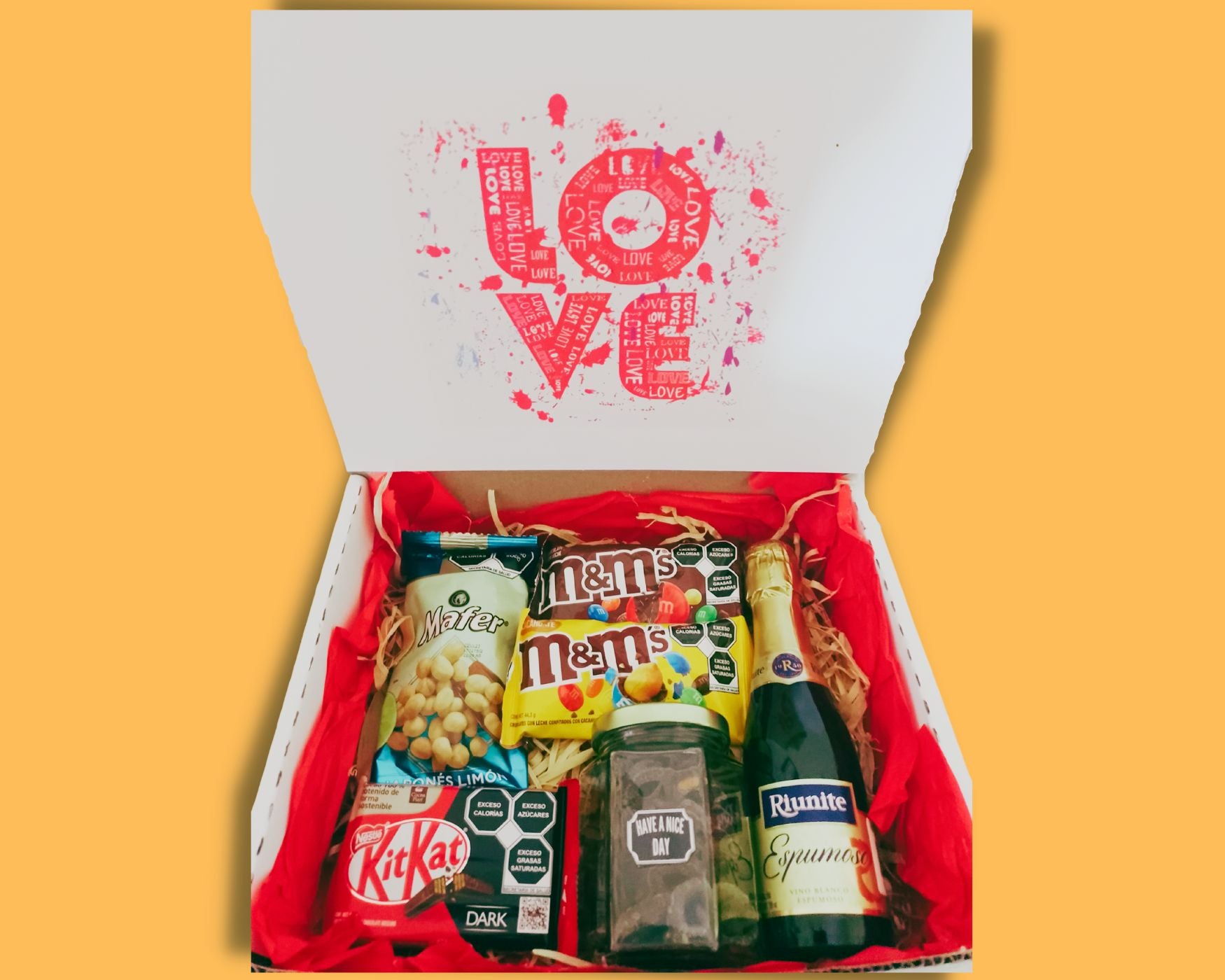 box con vino espumoso pretzels de chocolate cacahuates y chocolates suritdos caja de amor